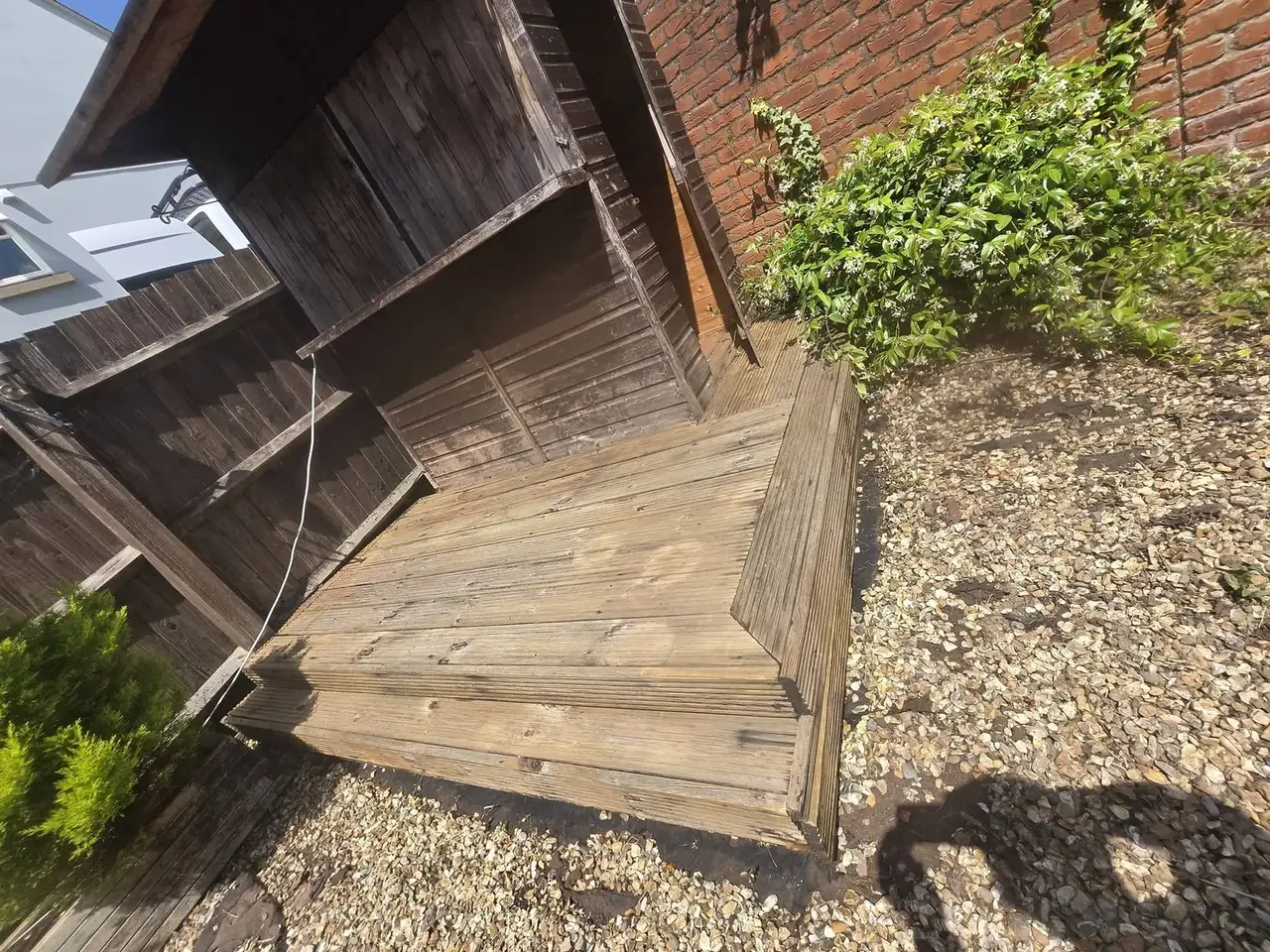 The same decking after cleaning, with the timber grain and natural colour restored
